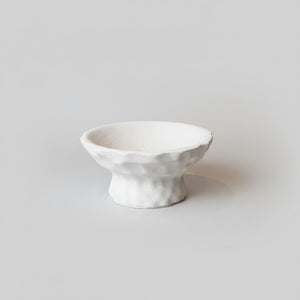 A small Luna Pedestal Dish Alba Lunarie bowl with a textured, organic wavy rim and a short pedestal base, photographed on a clean light gray background.