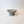 A small Luna Pedestal Dish Alba Lunarie with a textured, organic wavy rim, shown on a plain off-white background.