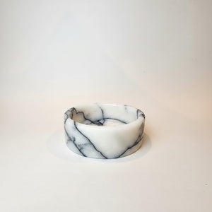 A Noir Blanc Marble Bowl Lunarie  with dark gray veining, photographed on a clean white background.
