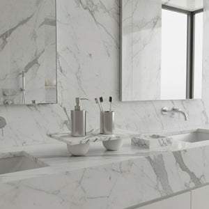 Noir Blanc  white marble tray lunarie place in  A modern bathroom vanity with a white marble countertop and matching marble backsplash, featuring a double sink, chrome faucet, soap dispenser, toothbrush holder, and mirrors.