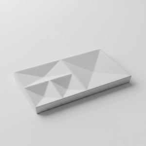A Peak Tray Lunarie Alba rectangular tray with a geometric, faceted triangular pattern on its top surface, shown on a clean light gray background.