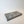 A rectangular Peak Tray Lunarie gray geometric tray with a faceted, pyramid-like pattern on top, photographed on a clean white background.