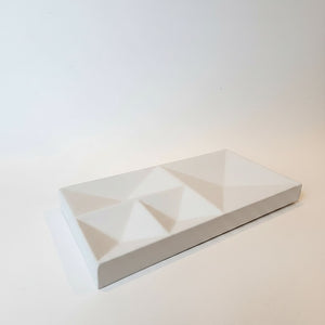 A Peak Tray Lunarie Dune with a geometric faceted triangular pattern on its top surface, photographed on a clean white background.