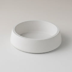 White ceramic bowl on a light gray background