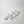 Vine Leaf Dish Lunarie Alba  with a continuous, wavy, interlocking design, arranged diagonally on a plain white background.