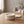 Astral Nock Jar by Lunarie featuring a textured white finish and matching lid, ideal as a decorative storage jar for jewelry and home essentials. place on a wooden table with a blurred  background