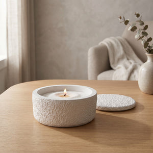 Astral Nock Jar by Lunarie featuring a textured white finish and matching lid, ideal as a decorative storage jar for jewelry and home essentials. place on a wooden table with a blurred  background