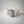 Cave Vessel Jar by Lunarie featuring an organic sculptural texture and matte finish, ideal as a decorative storage vessel for makeup brushes and home decor. Three concrete cave jars with textured surfaces on a plain background