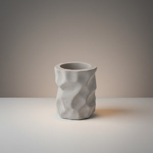 Cave Vessel Jar by Lunarie featuring an organic sculptural texture and matte finish, ideal as a decorative storage vessel for makeup brushes and home décor.