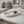 Eclipse Orbit Tray by Lunarie featuring a minimalist dual-circle design, ideal as a decorative catchall tray for jewelry and modern home décor. Watch and ring on a tray with books in the background on a marble surface.