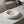 Halo Dish by Lunarie featuring a minimalist rounded design and matte finish, ideal as a jewelry catchall dish and decorative home accent. place  with gold ring and silver earrings on a marble surface.