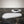 Moon Layers Duo by Lunarie featuring two nesting decorative trays with organic shapes, ideal for jewelry, candles, and modern home décor. Two white trays on a black marble surface with a key on one of them.