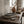 Moon Layers Trio by Lunarie featuring three nesting decorative trays with organic shapes, ideal for jewelry, candles, and modern home décor.  on a wooden table with a vase, books, and glass of whiskey in a cozy room.