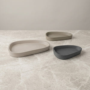 Moon Layers Trio by Lunarie featuring three nesting decorative trays with organic shapes, ideal for jewelry, candles, and modern home décor. placed  on a textured surface with a neutral background