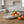 Nest Centerpiece Bowl by Lunarie featuring an organic sculptural shape with flowing curves, ideal as a decorative centerpiece bowl for modern home décor.   with oranges on a wooden table in a kitchen setting