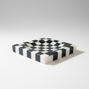 Noir Blanc Checkered Trinket Dish by Lunarie crafted from natural marble with a black and white checkered pattern and wavy sculptural design.