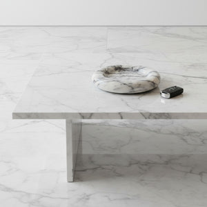 Noir Blanc Vein Marble Trinket Dish by Lunarie made from natural white marble with black veining, used on patterned coffee table with a car key on a matching surface.