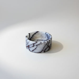 A noir blanc bold veins bowl made of white marble with dark gray and black veining, photographed on a clean white studio background.