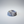 A polished noir blanc small bold veins dish, resembling a marble band, centered on a light gray gradient background.