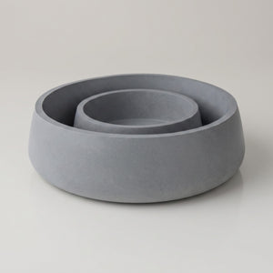 Orbit Bowl by Lunarie featuring a minimalist rounded design and matte finish, ideal as a decorative catchall bowl for jewelry and modern home décor. Two gray concrete bowls on a light gray background