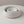 Set of two beige concrete bowls on a light gray background
