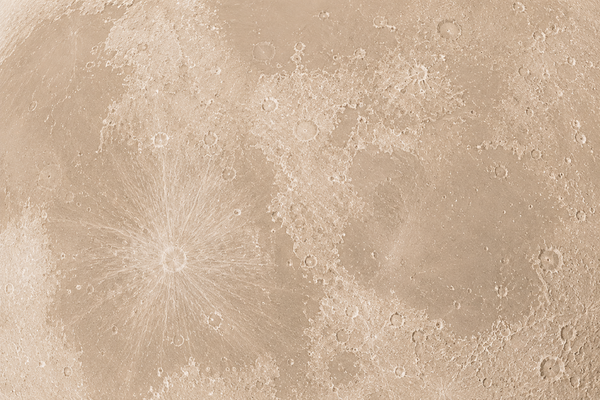Close-up of a textured beige surface with circular patterns